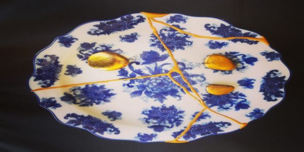 Kintsugi embracing imperfection blue and gold ceramic piece