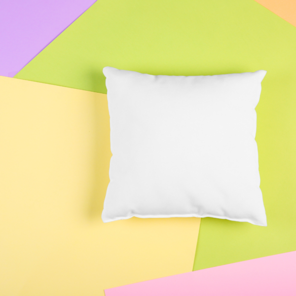 close up of white pillow on colorful background
