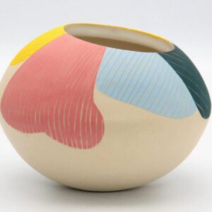 surface design colorful clay bowl resting on white table space