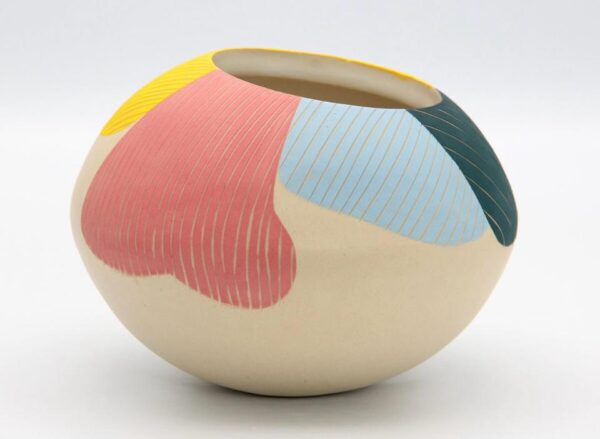 surface design colorful clay bowl resting on white table space