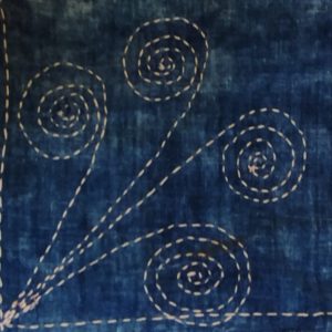 close up of linen place mats with sashiko and kantha embroidery stitching