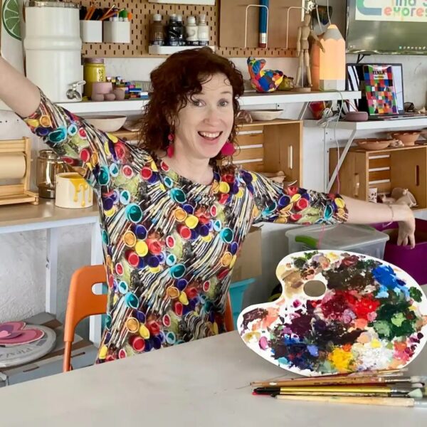 Gracie Rhoads, Ceramics and Arts Instructor in her studio filled with color