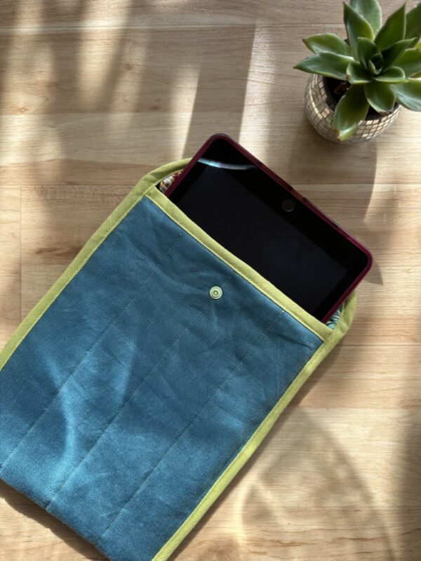 photo of sewn fabric tablet pouch open with device