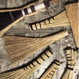 close-up of handmade brooms