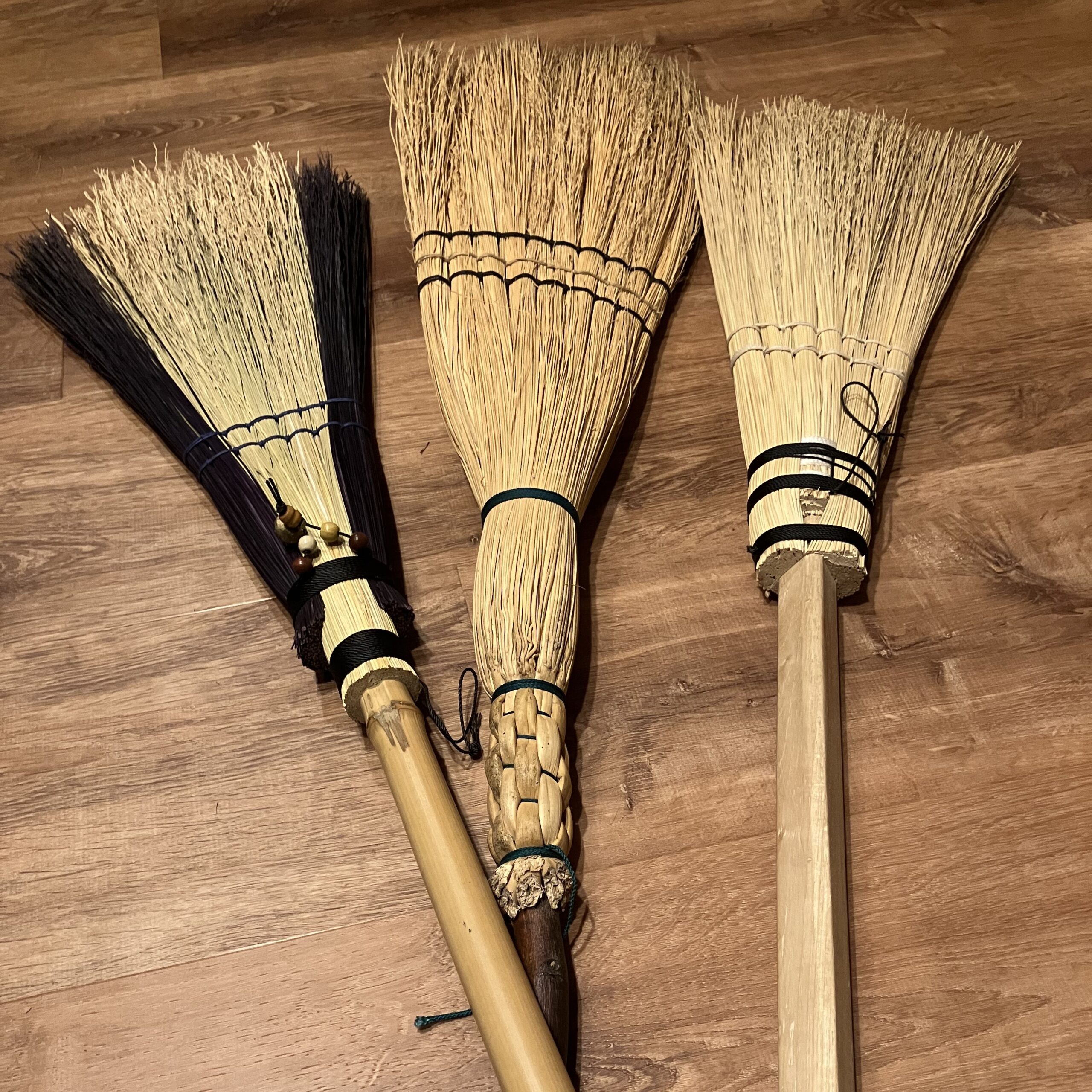 close-up of handmade brooms