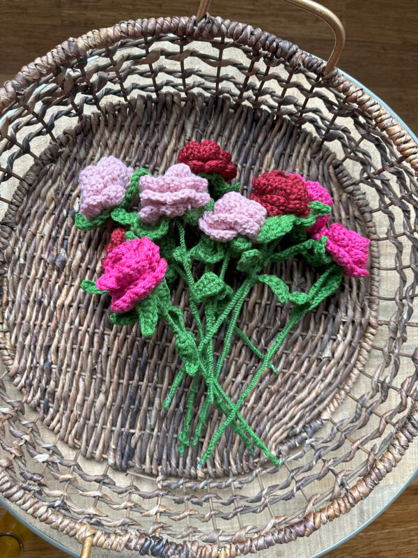 crochet flowers laying flat on basket