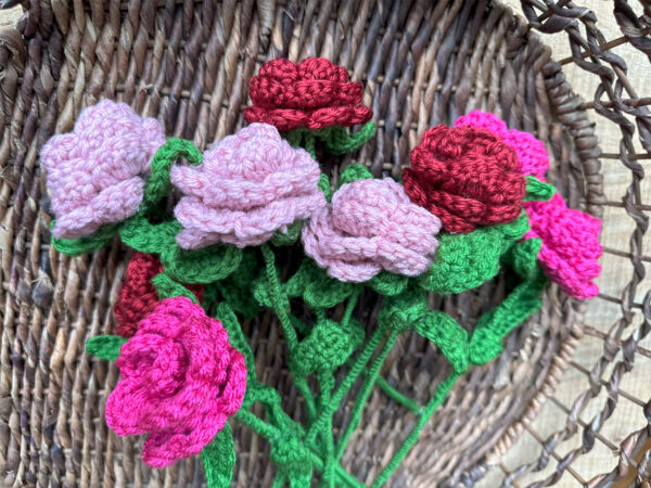 crochet flowers laying flat on basket