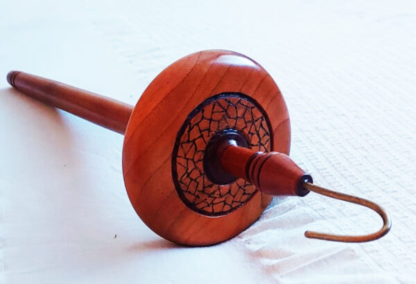 close up of handmade woodturned drop spindle