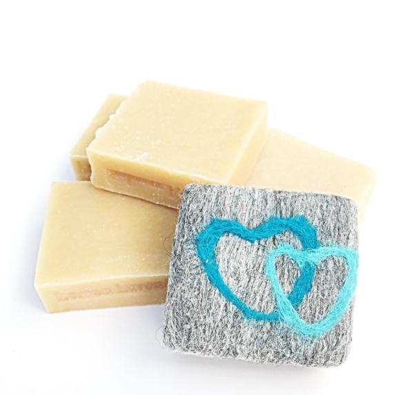 close up of soap and felt soap bar