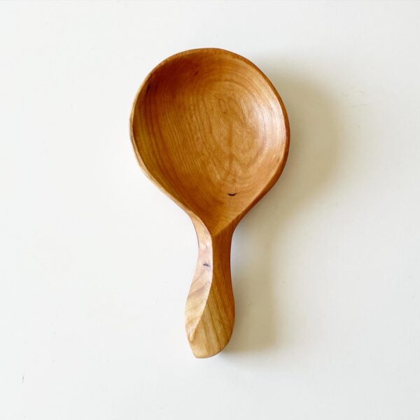 close up of wooden power carved spoon