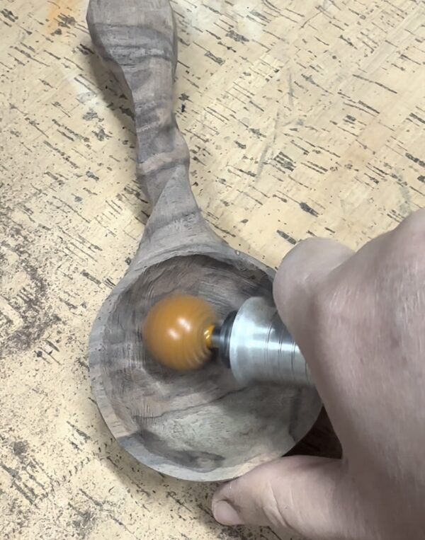 power carving tool on wooden spoon