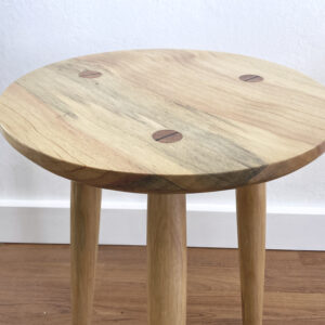 top of wooden stool with round seat