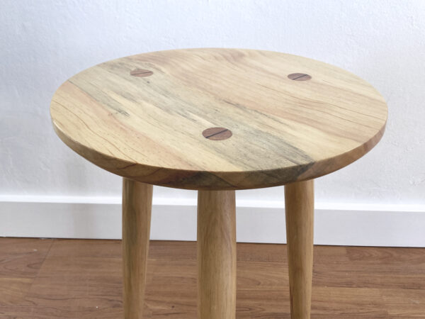 top of wooden stool with round seat