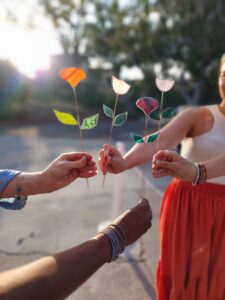 hands holding Stained Glass Flowers