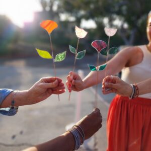 hands holding Stained Glass Flowers