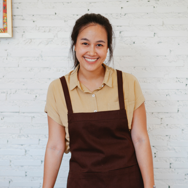 person wearing a brown apron