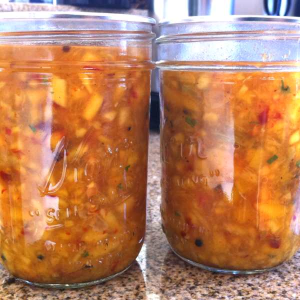 two jars of fermented pickled summer fruits