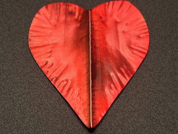 Foldforming and patinas on red heart shaped piece