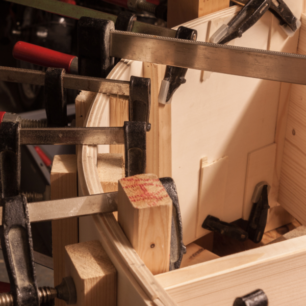 close up of steam bending wood process and implements