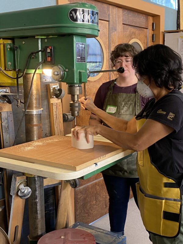 woman making bandsaw box in woodshop