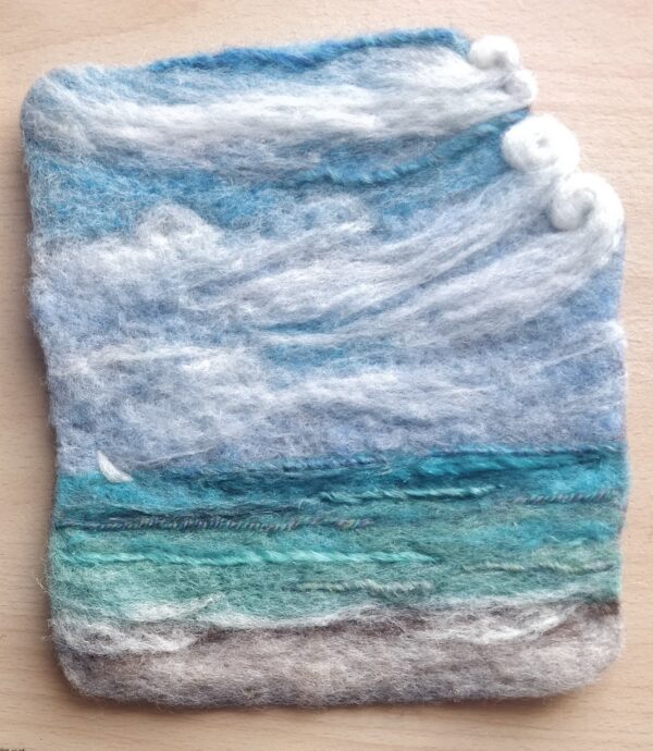 needle felted ocean scene of blue, greens