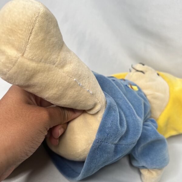 hands mending stuffed animal