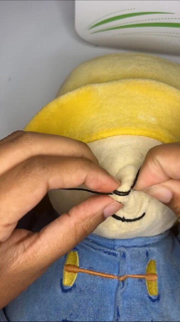 hands mending stuffed animal