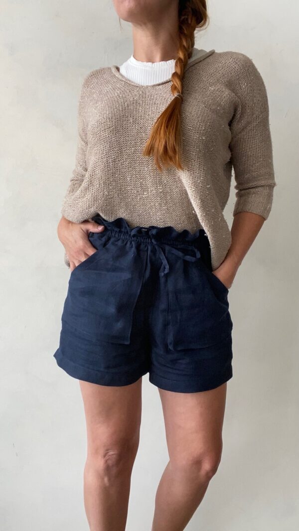 woman in hemmed blue shorts