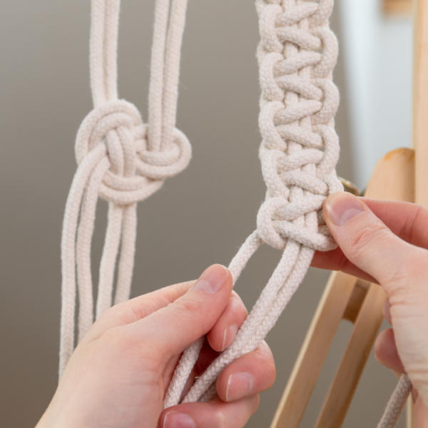 hands doing macrame