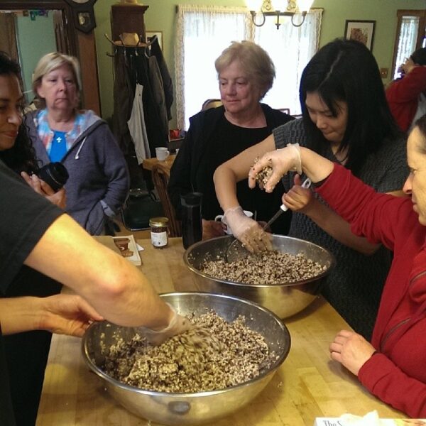 students learning to make miso