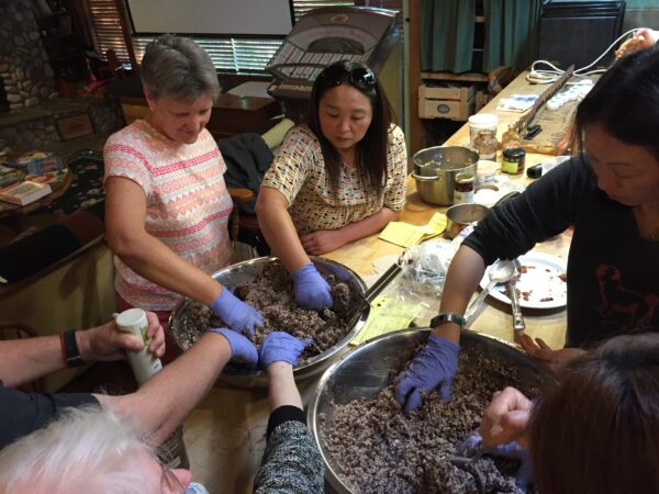 students learning to make miso