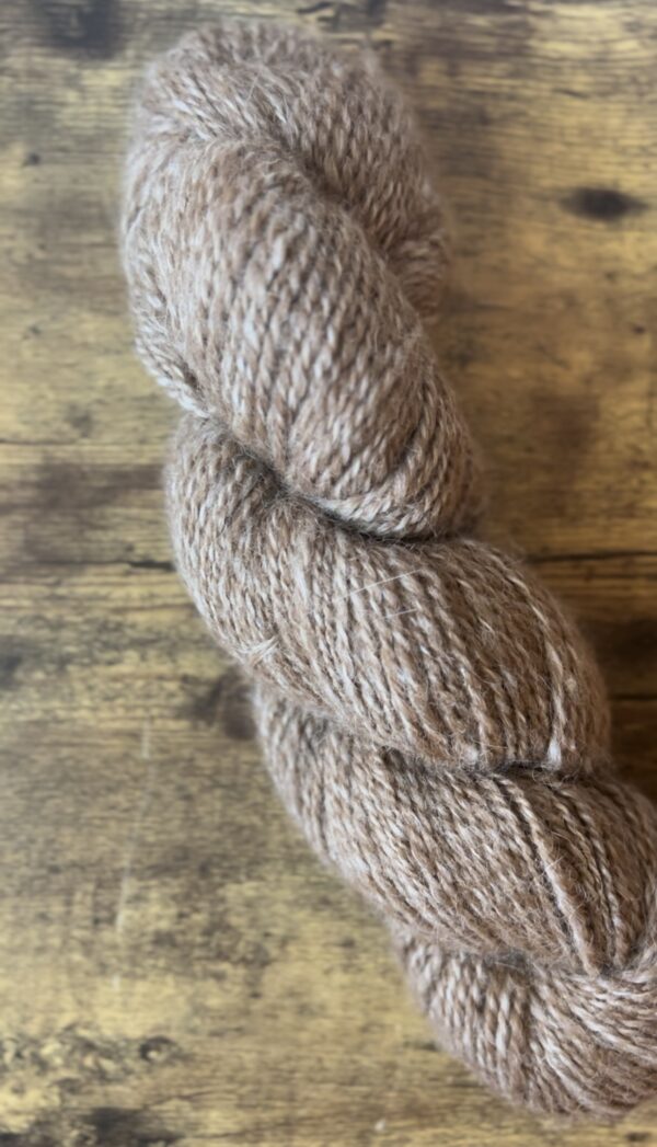natural wool hand-spun into yarn