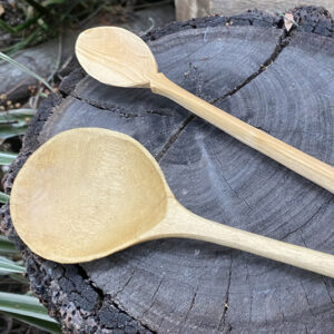 close up of wooden wood carved straight spoons