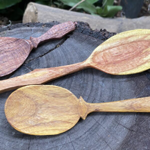 close up of eater and serving spoons hand carved with wood