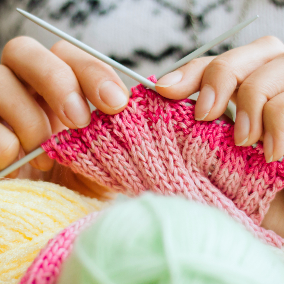 hands, knitting needles, yarn, knitting project
