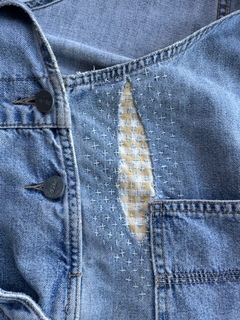 visible mending on jean fabric