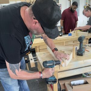 persons woodworking in woodshop