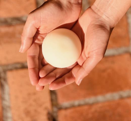 recovery massage bar held in two hands